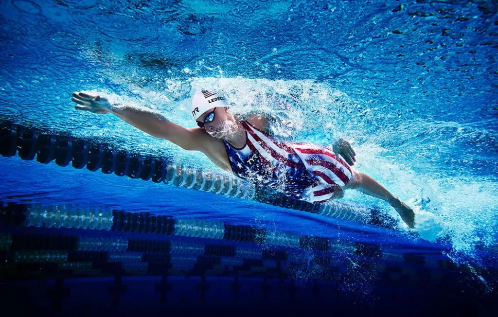 Swimming Gold: The Inspiring Journeys of Professional Competitive Swimmers 5 Professional Competitive Swimmer Katie Ledecky Swimming in the Pool