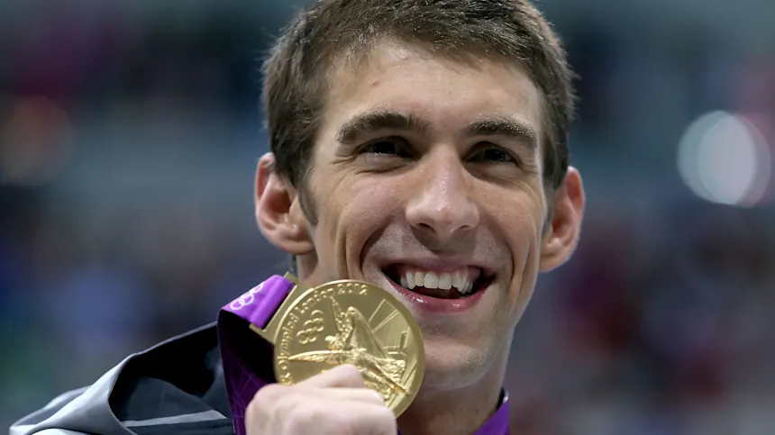 Swimming Gold: The Inspiring Journeys of Professional Competitive Swimmers 3 michael phelps gold medal
